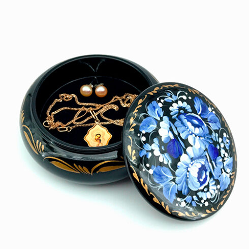 Round jewelry box hand painted and lacquered blue and white with jewelry