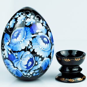 Decorative wooden egg hand painted blue and white with a holder