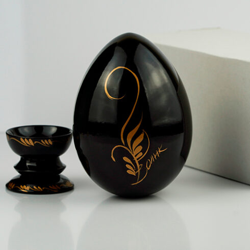 Decorative wooden Easter egg with packaging