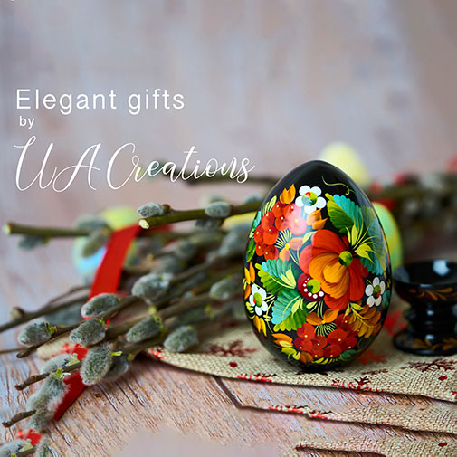 Decorative Easter Egg with Pussy Willow Branches Bouquet on a wooden table